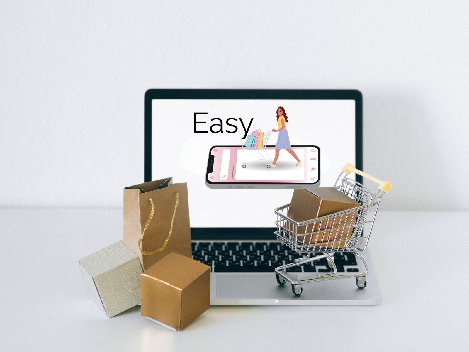 Online shopping concept with laptop, trolley and parcels