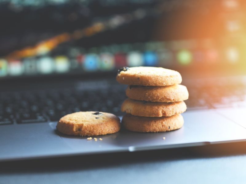 Stack of cookies on a laptop keyboard